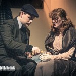 a young man and women in a stage production of THE DIARY OF ANNE FRANK