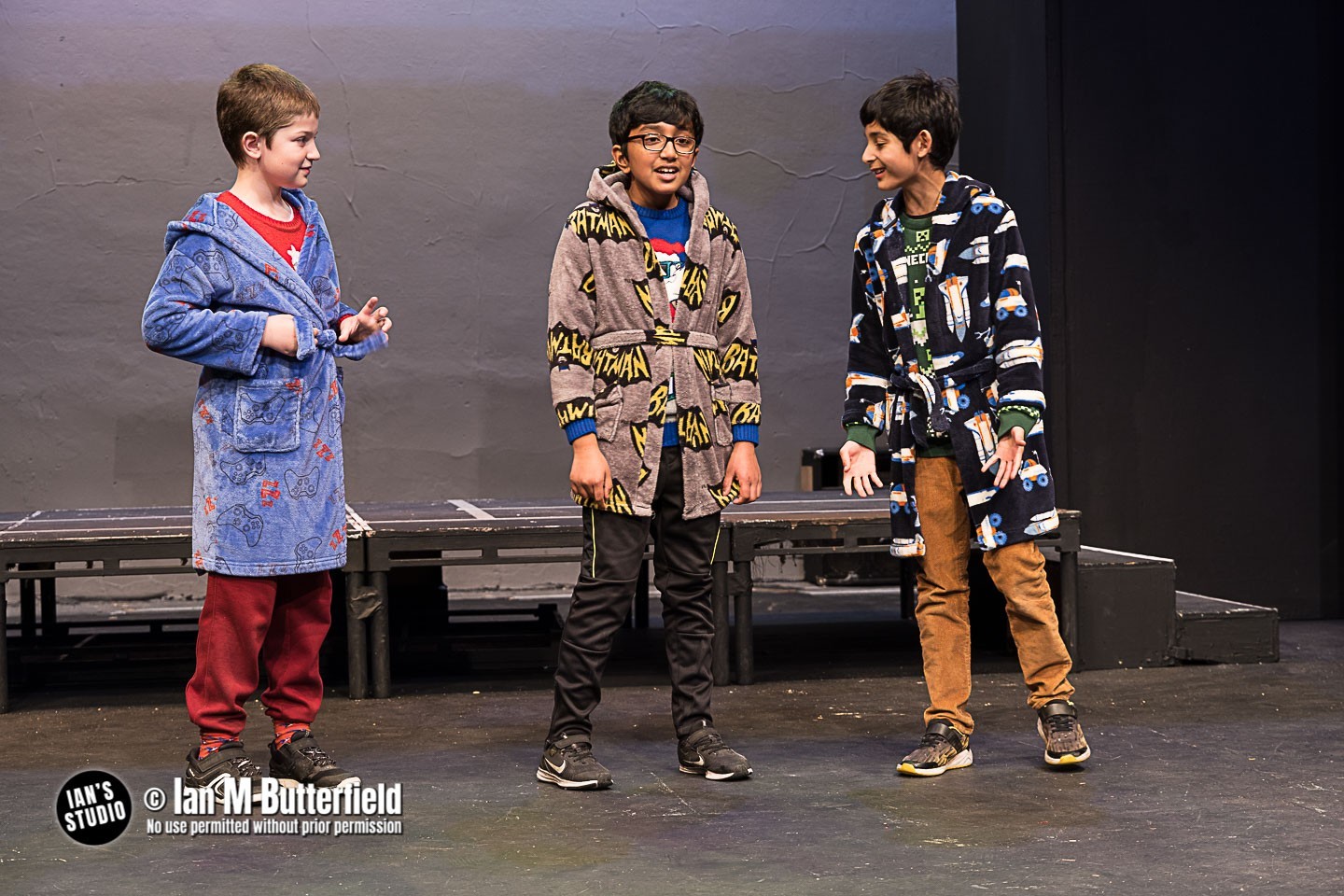 3 boys in dressing gowns