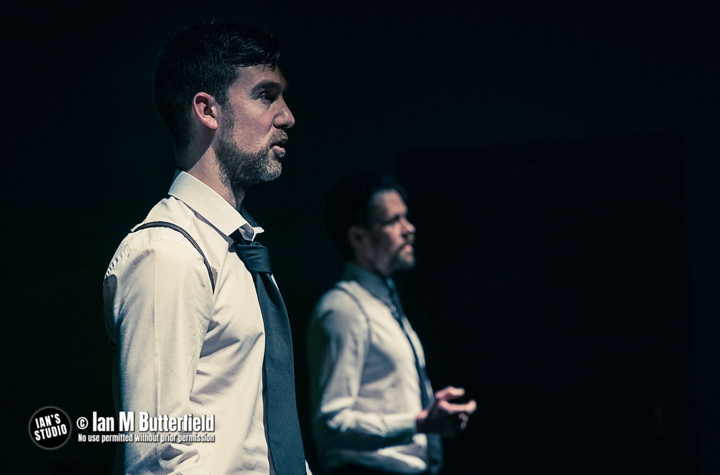 Two men in white shirts and ties