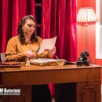 A women sat at a desk